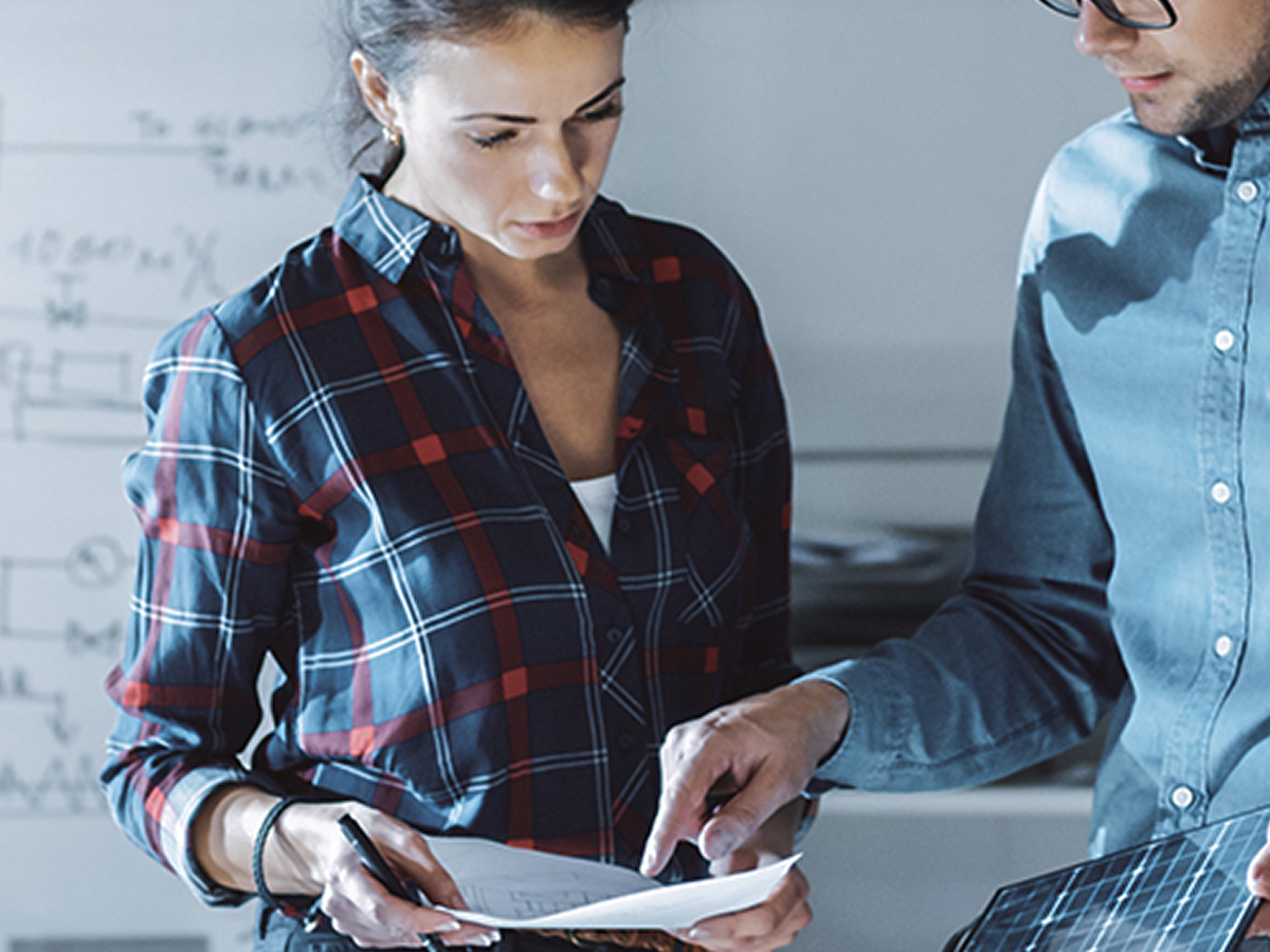 Engineering Salesperson showing documents to client